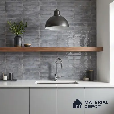 Modern kitchen with grey subway wall tiles, matte grey laminate cabinets, and white quartz countertop