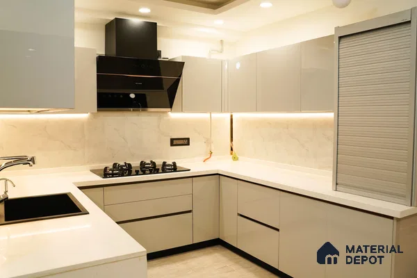 Modern kitchen with high gloss beige laminate, white quartz countertop, and marble-look backsplash in Bengaluru | Material Depot