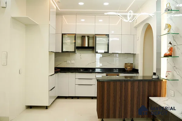 Modern kitchen with high gloss white laminate, black granite countertop, marble-look backsplash, and fluted wood island in Bengaluru | Material Depot