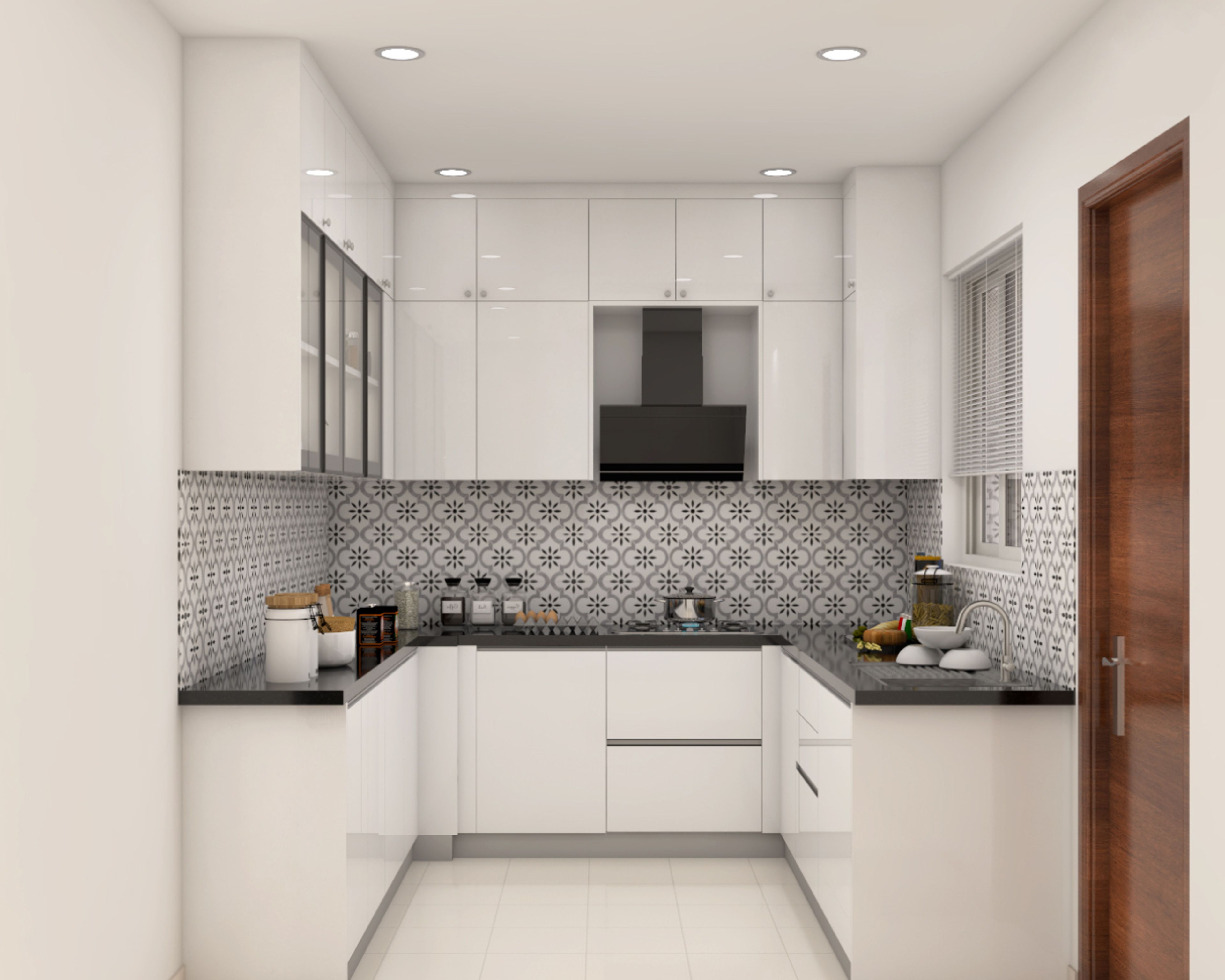 Modern kitchen with high gloss white laminate cabinets, black granite countertop, and patterned monochrome backsplash tiles in Bengaluru | Material Depot