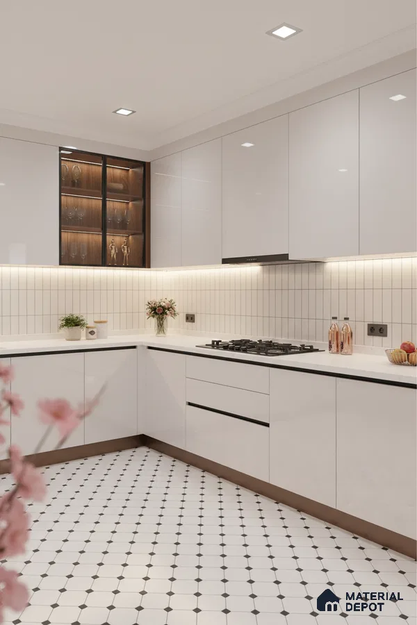 Modern kitchen with high gloss white laminate cabinets, white quartz countertop, and geometric patterned floor tiles in Bengaluru