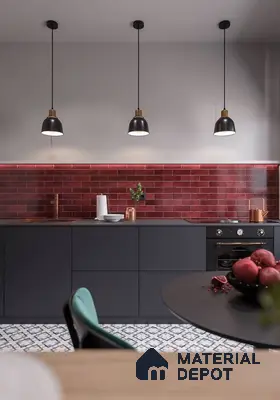 Modern kitchen with matte black laminate cabinets, red subway backsplash tile, and patterned floor tile in Bengaluru | Material Depot
