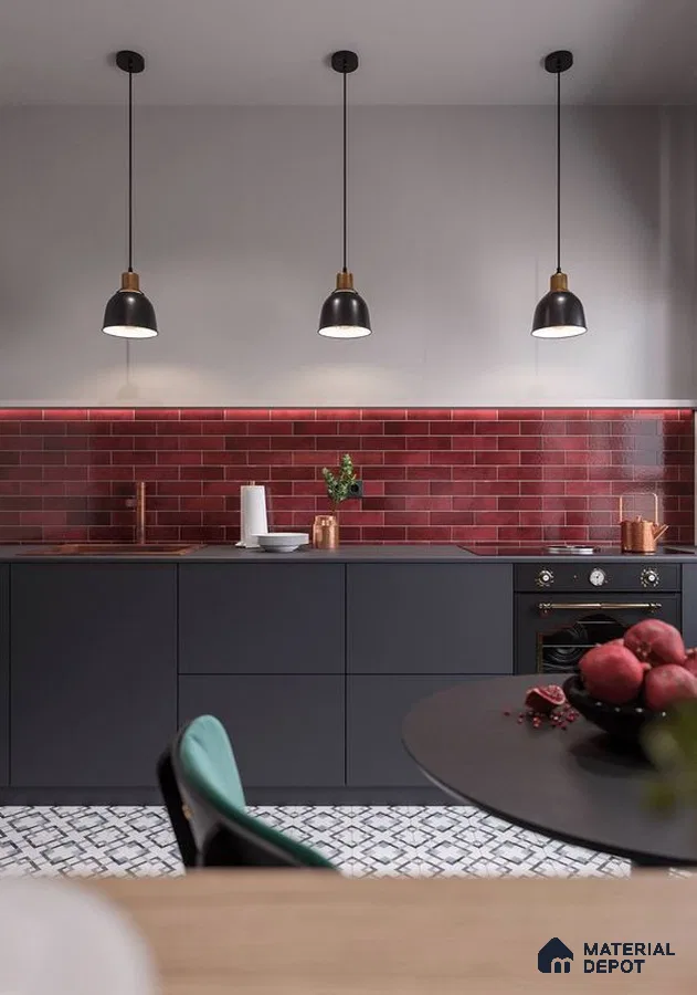 Modern kitchen with matte black laminate cabinets, red subway backsplash tile, and patterned floor tile in Bengaluru | Material Depot