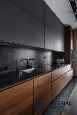 Modern kitchen with matte black laminate, walnut wood laminate, and black stone countertop in Bengaluru | Material Depot