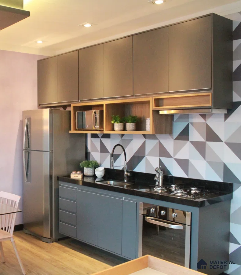 Modern kitchen with matte grey laminate cabinets, black granite countertop, and geometric patterned backsplash tile in Bengaluru | Material Depot