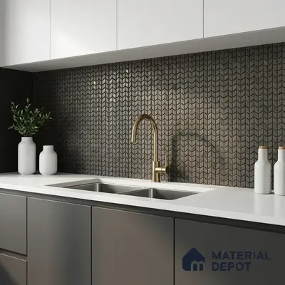 Modern kitchen with matte grey laminate cabinets, white quartz countertop, and geometric metallic chevron backsplash tile