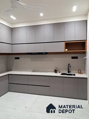 Modern kitchen with matte grey laminate cabinets, white quartz countertop, and light grey floor tiles in Bengaluru | Material Depot