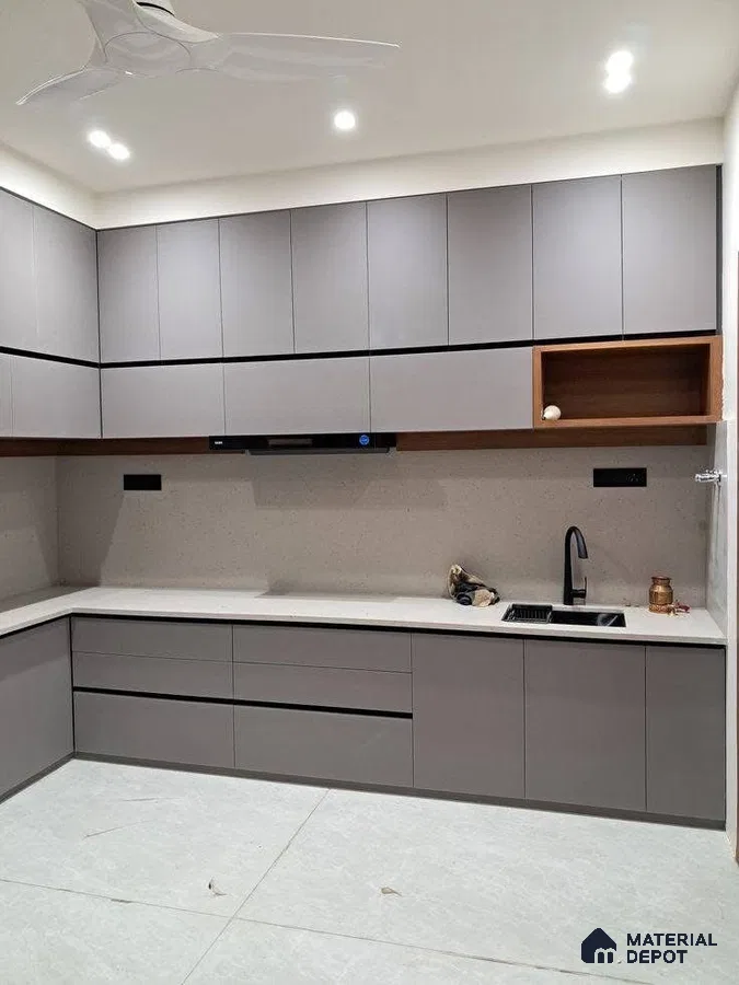 Modern kitchen with matte grey laminate cabinets, white quartz countertop, and light grey floor tiles in Bengaluru | Material Depot