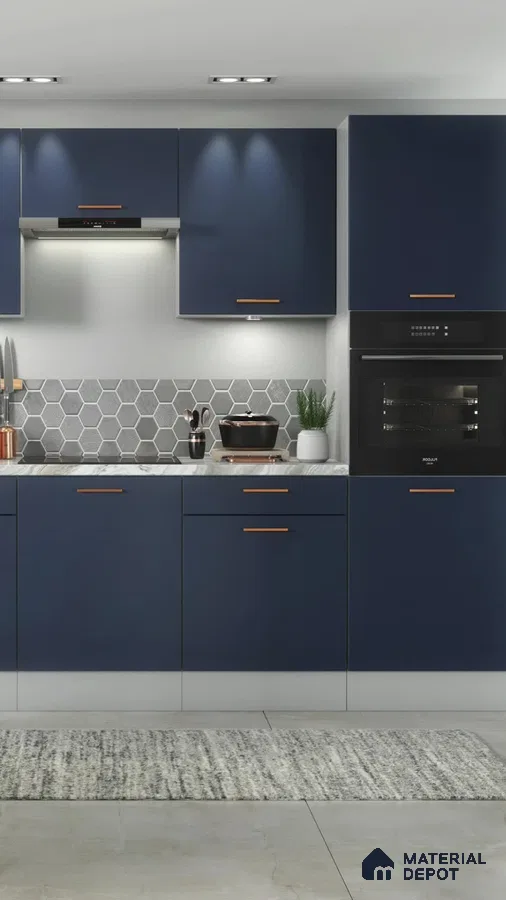 Modern kitchen with navy blue laminate cabinets, grey hexagonal backsplash tiles, and marble countertop in Bengaluru | Material Depot