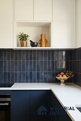 Modern kitchen with navy blue vertical subway backsplash tile and white quartz countertop