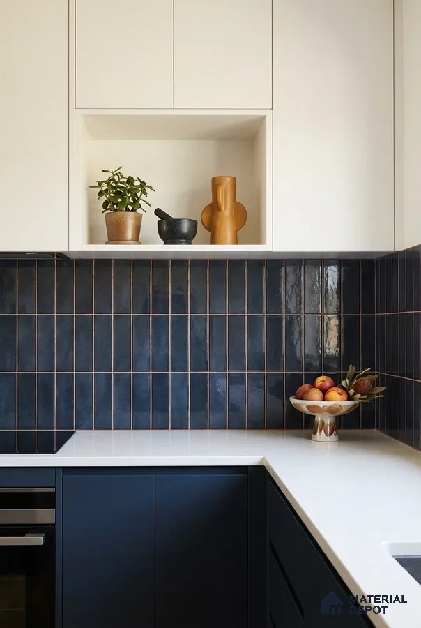Modern kitchen with navy blue vertical subway backsplash tile and white quartz countertop