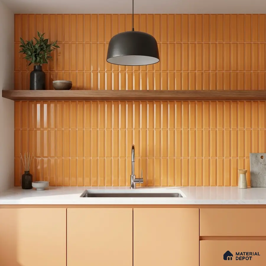 Modern kitchen with orange kitkat wall tiles, peach laminate cabinets, and white quartz countertop