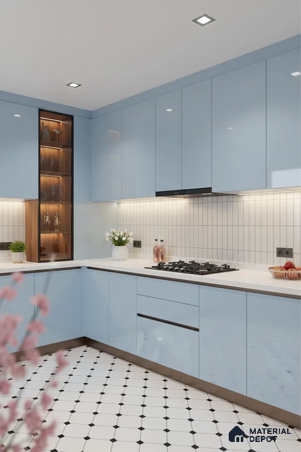Modern kitchen with pastel blue high gloss laminate, white quartz countertop, and geometric patterned floor tiles in Bengaluru