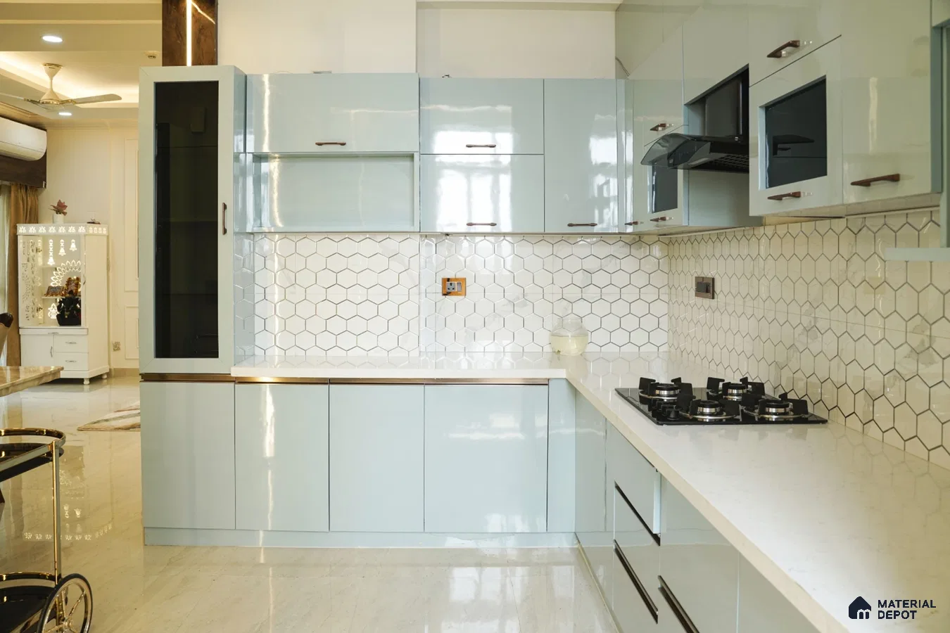 Modern kitchen with pastel blue high gloss laminate, white quartz countertop, and white hexagonal backsplash tile in Bengaluru | Material Depot
