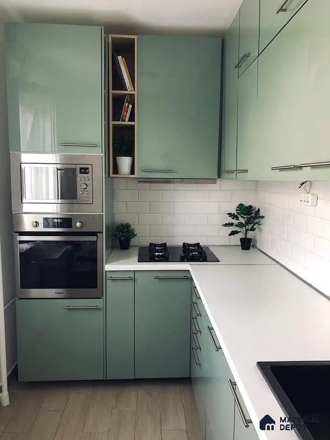 Modern kitchen with pastel green high gloss laminate cabinets, white quartz countertop, and white subway tile backsplash in Bengaluru | Material Depot