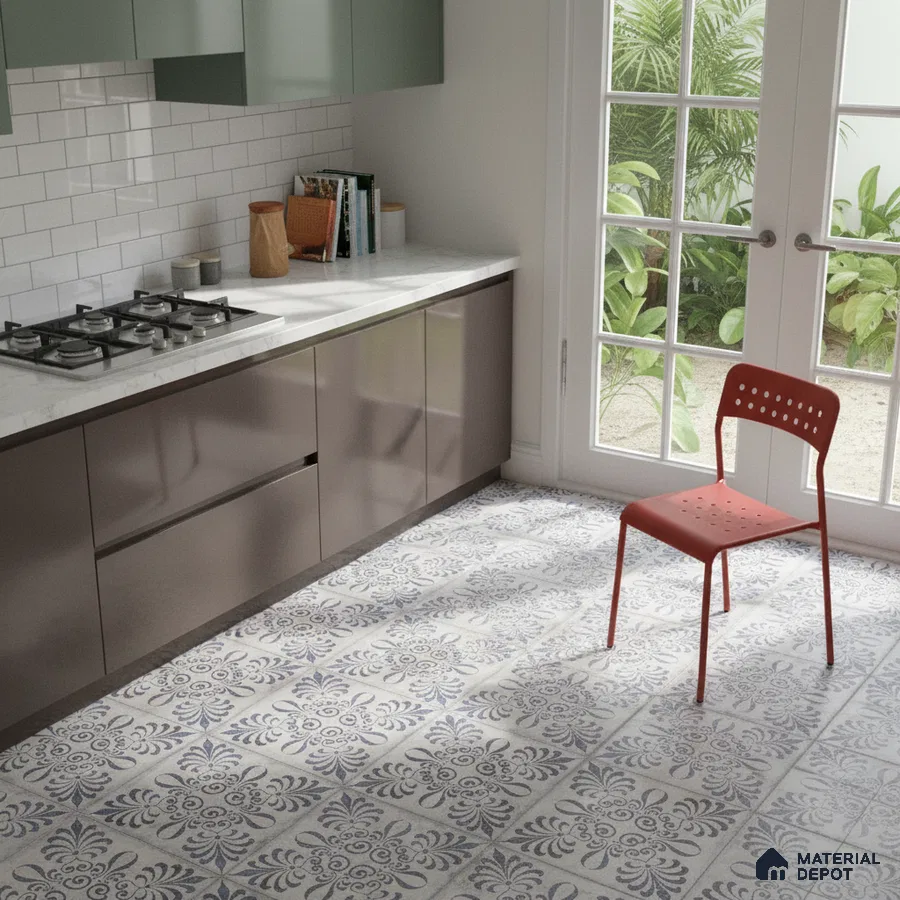 Modern kitchen with sage green and taupe laminate, white marble countertop, and blue patterned floor tiles in Bengaluru