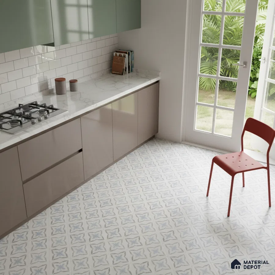 Modern kitchen with sage green and taupe laminate, white marble countertop, and blue patterned floor tiles in Bengaluru