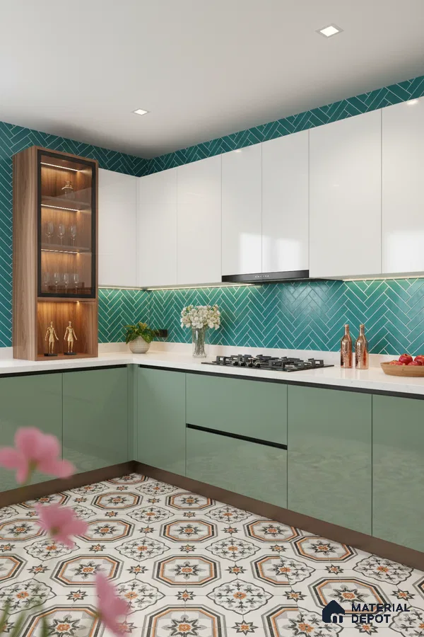 Modern kitchen with sage green and white laminate, teal herringbone subway backsplash tile, and patterned moroccan floor tile in Bengaluru