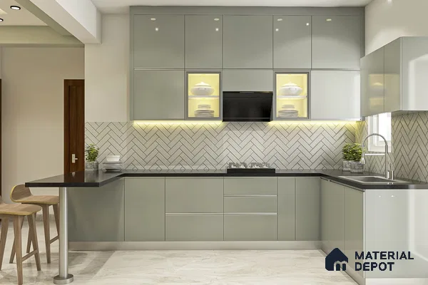 Modern kitchen with sage green high gloss laminate, black quartz countertop, and herringbone subway tile backsplash in Bengaluru | Material Depot
