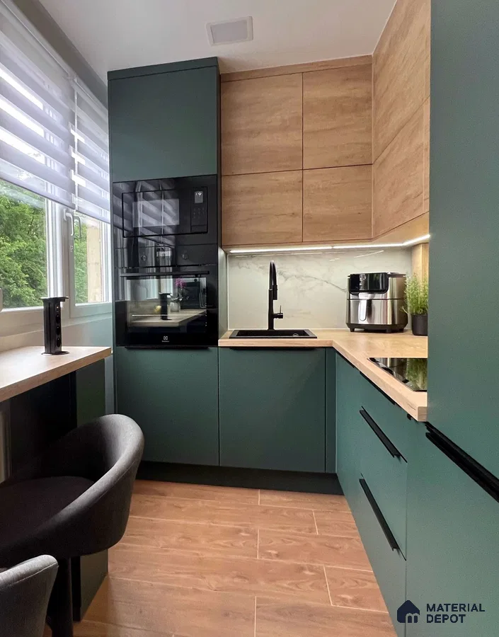 Modern kitchen with sage green laminate, light oak wood laminate, and marble-look backsplash in Bengaluru | Material Depot