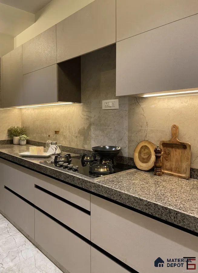 Modern kitchen with taupe matte laminate cabinets, grey granite countertop, and marble-look backsplash in Bengaluru | Material Depot