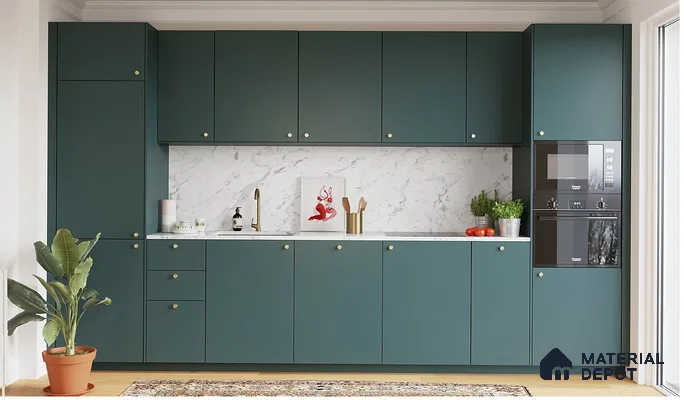 Modern kitchen with teal green matte laminate cabinets and white marble-look backsplash in Bengaluru | Material Depot