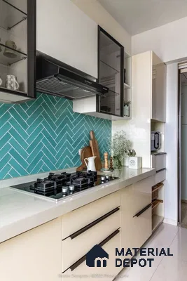 Modern kitchen with teal herringbone subway tile backsplash and frosty white laminate cabinets in Prestige Kew Gardens Bellandur 3 BHK Bengaluru Apartment