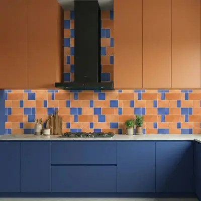 Modern kitchen with terracotta and blue laminate, geometric blue and terracotta backsplash tiles