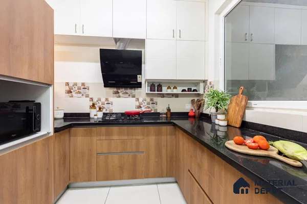 Modern kitchen with walnut brown wood laminate, white solid laminate, and black granite countertop in Bengaluru | Material Depot