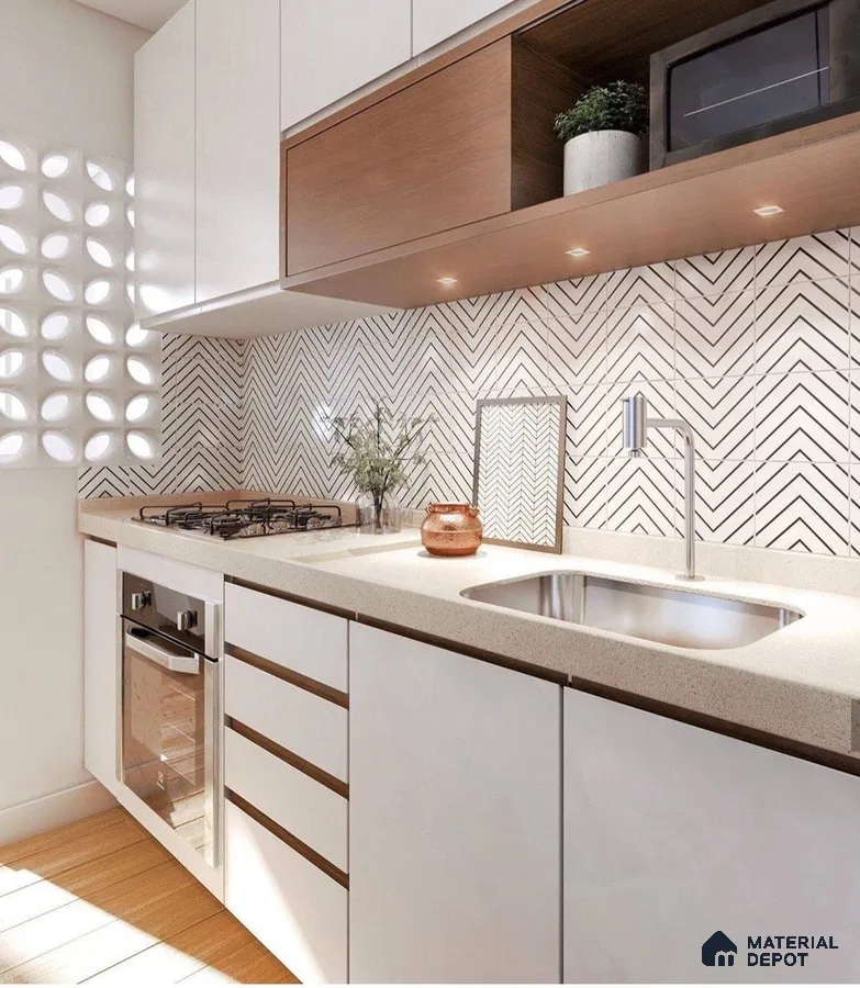 Modern kitchen with white laminate cabinets, beige quartz countertop, and chevron patterned backsplash tiles in Bengaluru | Material Depot