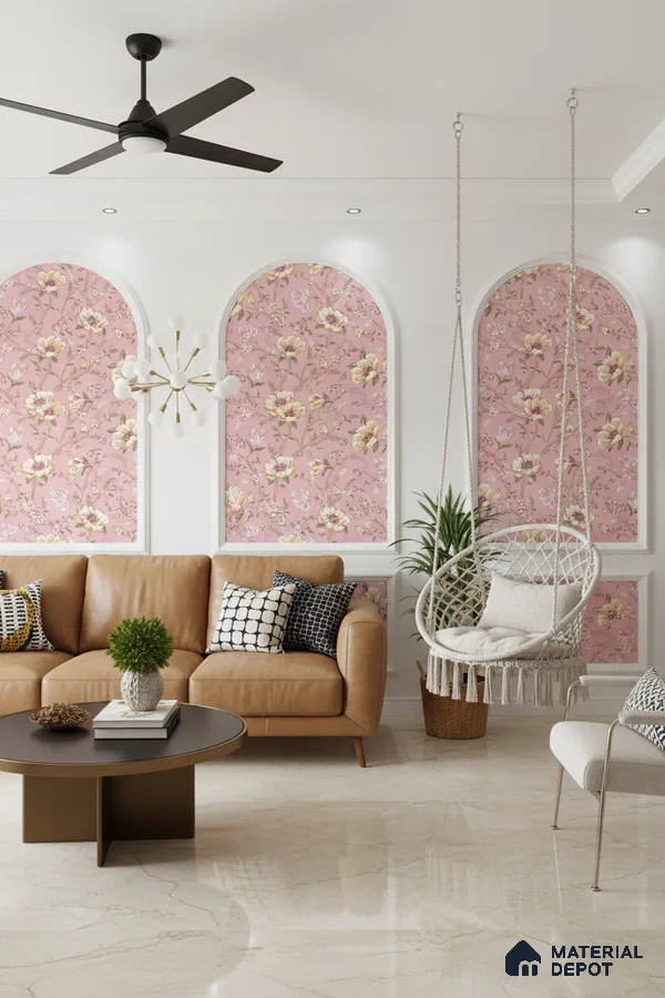 Modern living room with pink floral wallpaper, tan leather sofa, and cream marble floor tiles in Bengaluru
