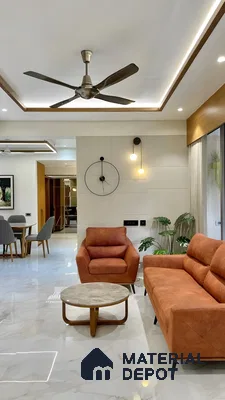 Modern Living Room with Sleek Marble Flooring and Orange Accents | Material Depot