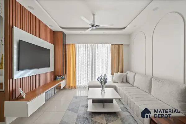 Modern living room with walnut wood louver panel, white marble laminate TV wall, and glossy beige floor tile of 2 BHK in Purva Palm Beach Hennur Bengaluru | Material Depot
