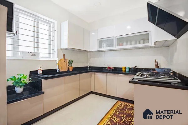 Modern L-shaped kitchen with beige and white high gloss laminate cabinets and black granite countertop in Bengaluru | Material Depot