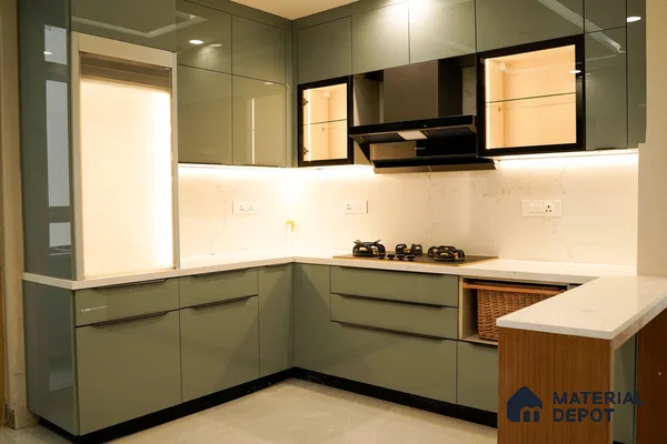 Modern L-shaped kitchen with sage green high gloss laminate, white marble-look quartz countertop, and marble-look backsplash in Bengaluru | Material Depot