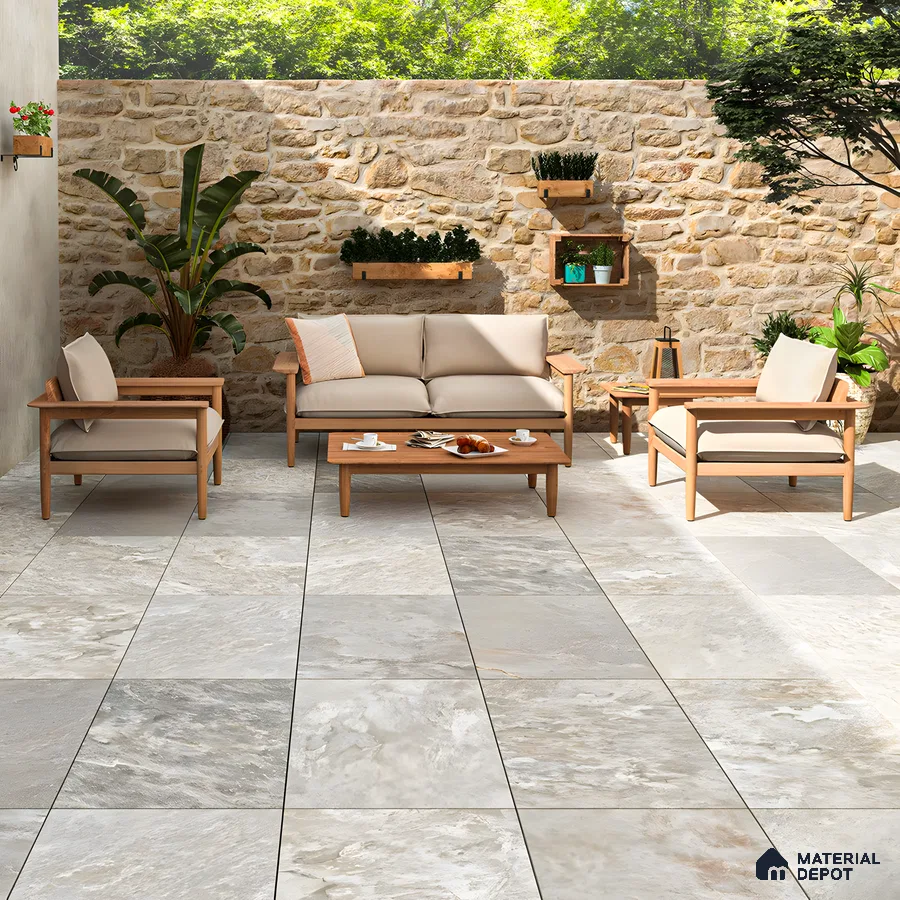 Modern Outdoor Living Space with Stone Wall and Grey Porcelain Tiles | Material Depot