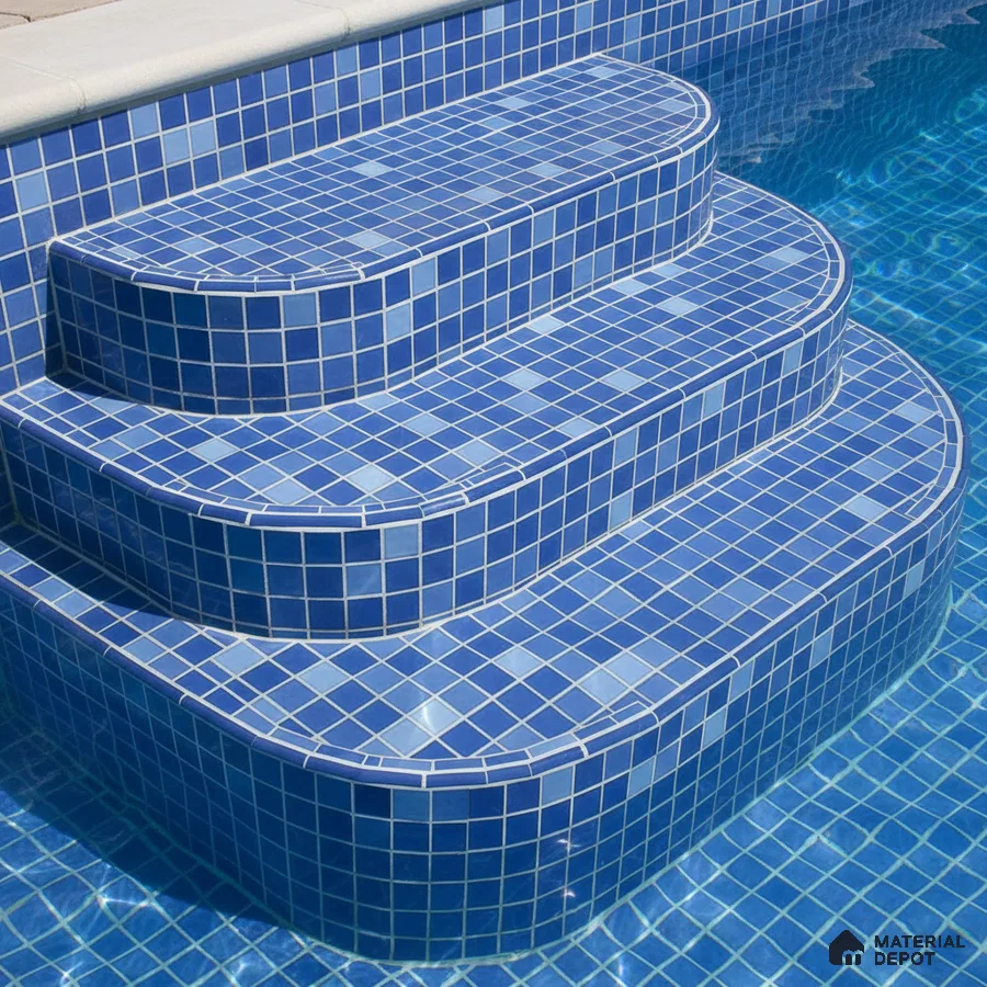 Modern outdoor pool with blue mosaic tiles on steps and walls