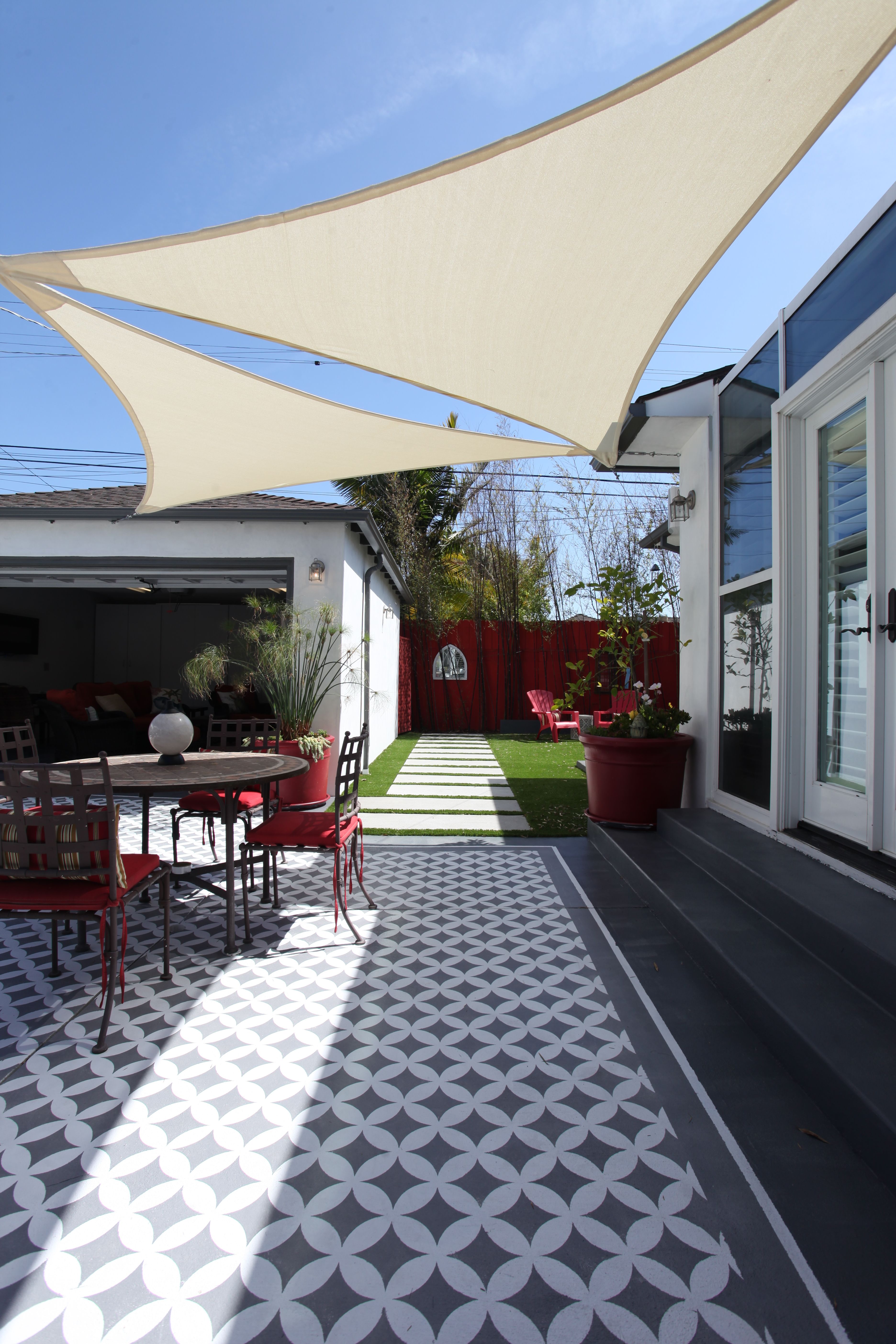 Modern Patio with Sun Shade Sail and Geometric Tile Pattern | Material Depot