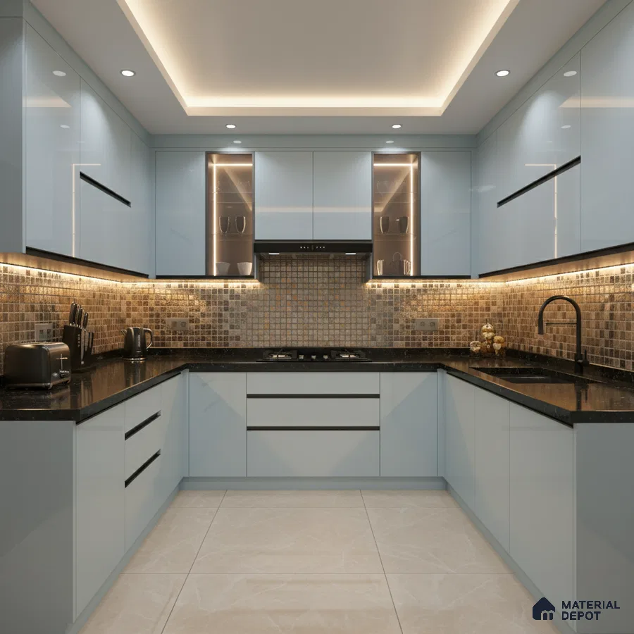 Modern U-shaped kitchen with glossy pastel blue laminate, mosaic tile backsplash, and black granite countertop in Bengaluru