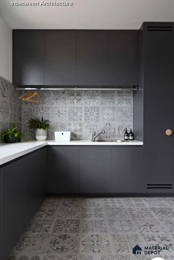 Modern utility room with matte charcoal laminate cabinets, white quartz countertop, and grey patterned moroccan tiles in Bengaluru | Material Depot