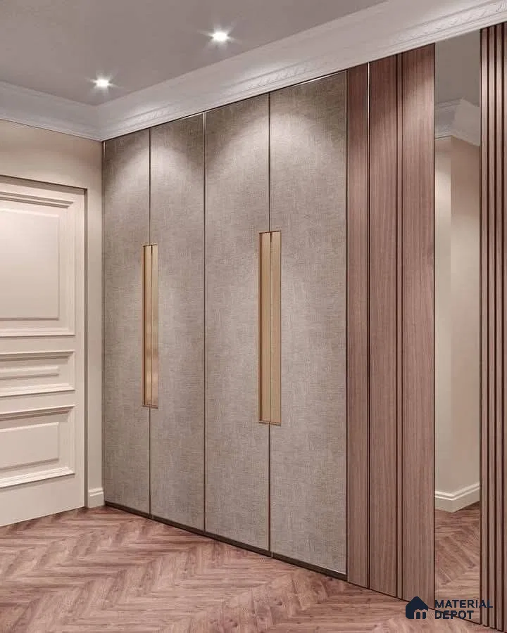 Modern wardrobe with beige fabric laminate shutters, walnut brown fluted panels, and herringbone wooden flooring | Material Depot