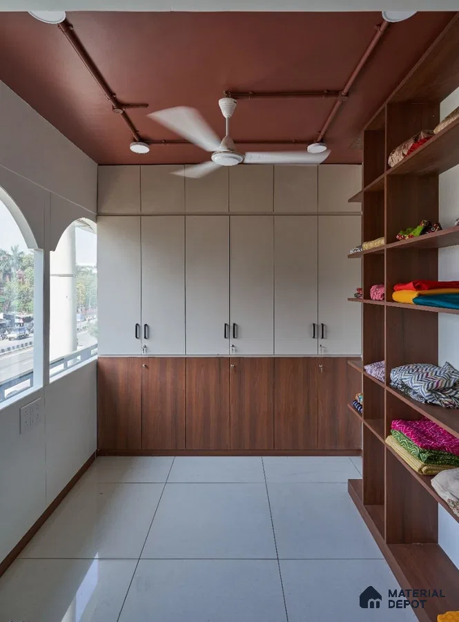 Modern wardrobe with frosty white and walnut brown laminate, open shelving, and large white floor tiles | Material Depot