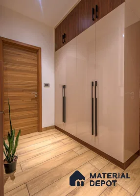 Modern wardrobe with glossy beige laminate shutters and walnut wood accents on wood-look floor tile | Material Depot