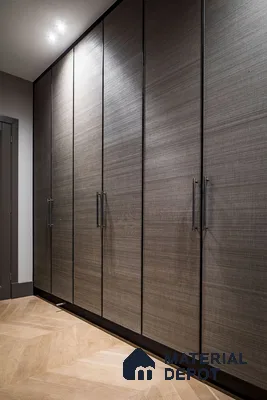 Modern wardrobe with textured grey laminate shutters and light oak herringbone wooden flooring | Material Depot