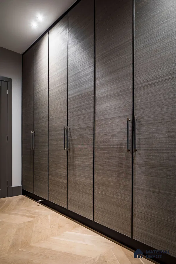 Modern wardrobe with textured grey laminate shutters and light oak herringbone wooden flooring | Material Depot