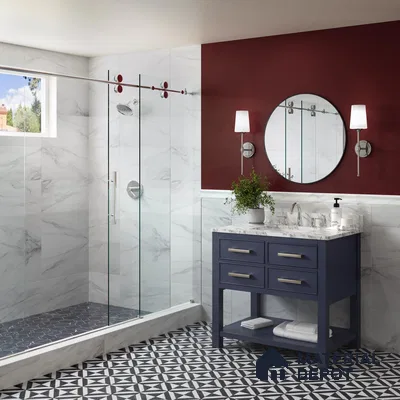 Bath area with patterned foor tiles and marble wall tile