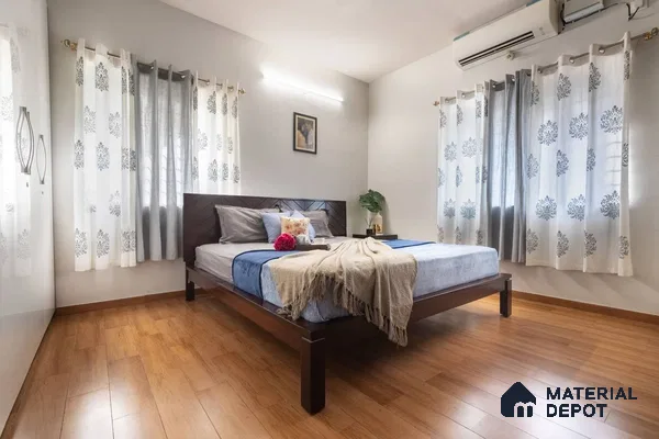 Master bedroom with wooden laminate flooring and light grey walls