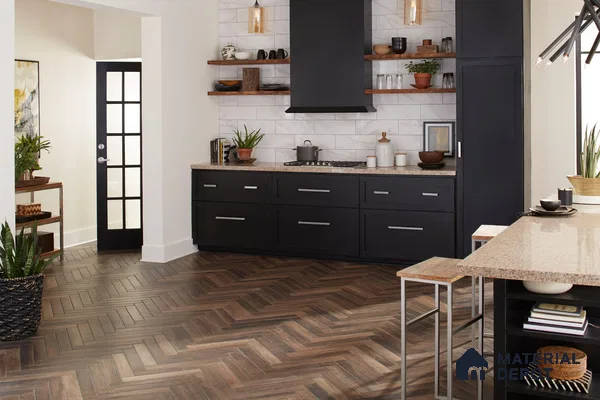Kitchen with patterned wooden floor and black laminate