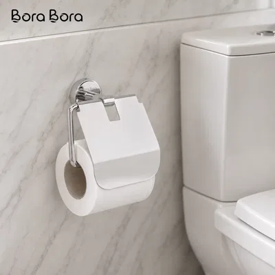 Paper Holders - chrome toilet paper holder with cover on a marble wall beside a WC