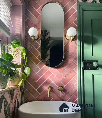 Pink and Green Bathroom with Herringbone Tiles and Gold Accents | Material Depot